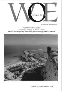 Magazine cover 'WOE' with black-and-white photograph of coastal city and cliffside fortress